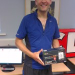 Tom Hollins with his prize after the 10 Peaks, Lake District, UK, 2013
